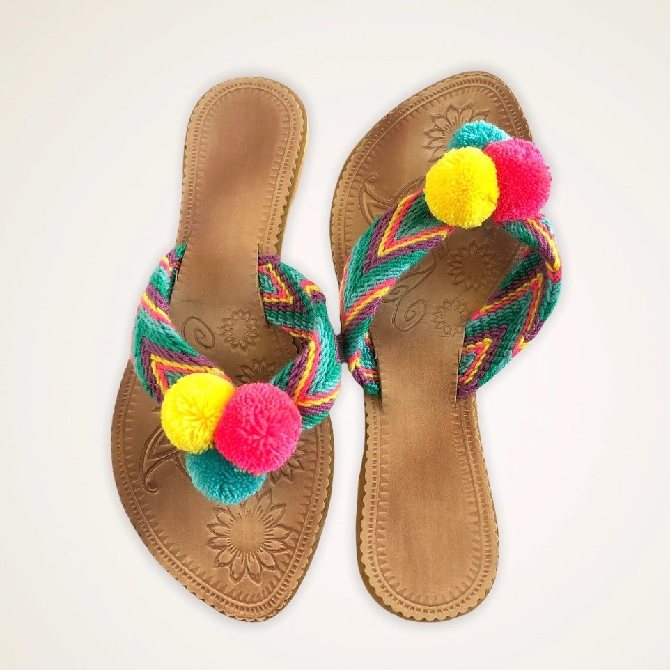 Flip flops with pom poms discount